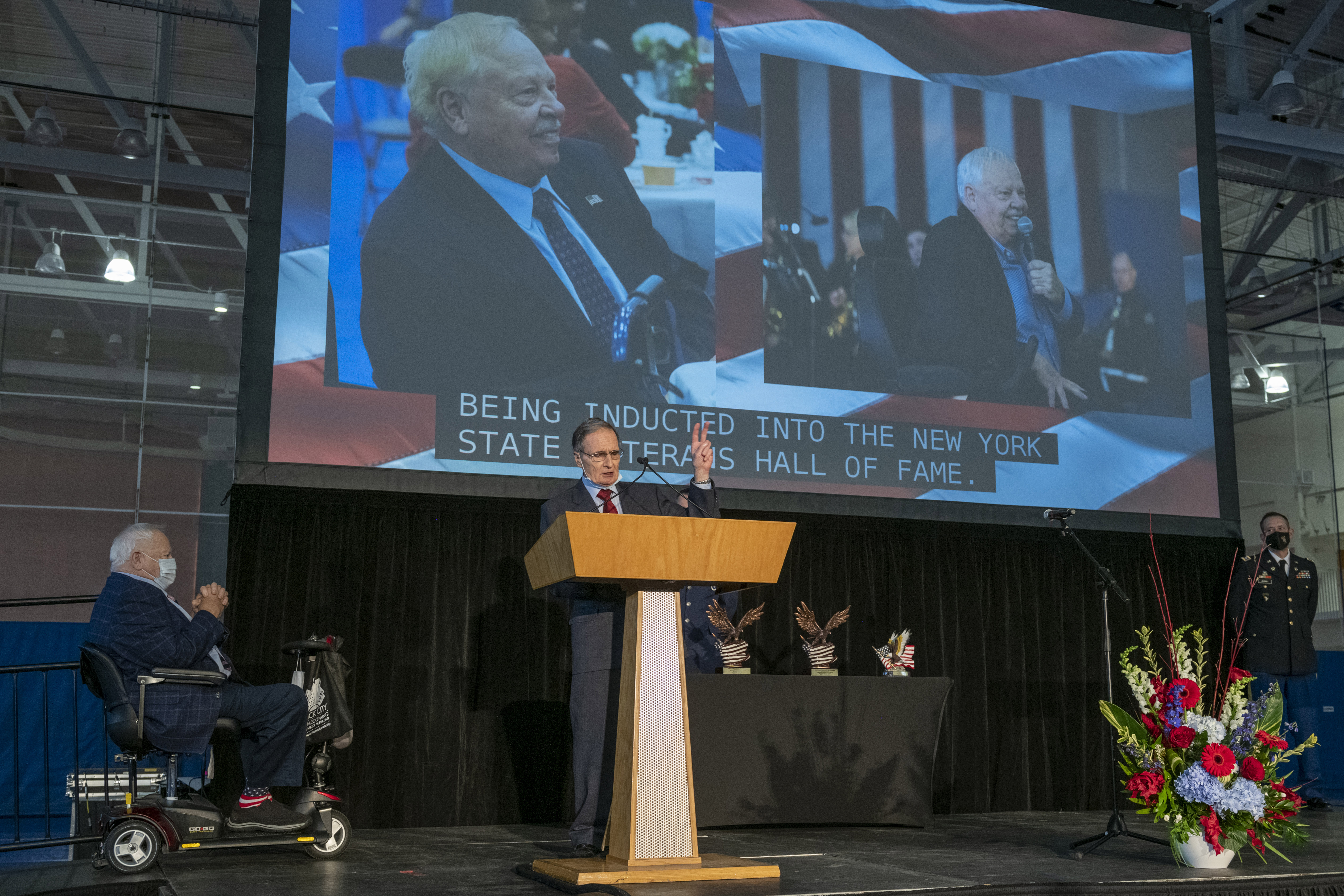 people on stage in front of podium