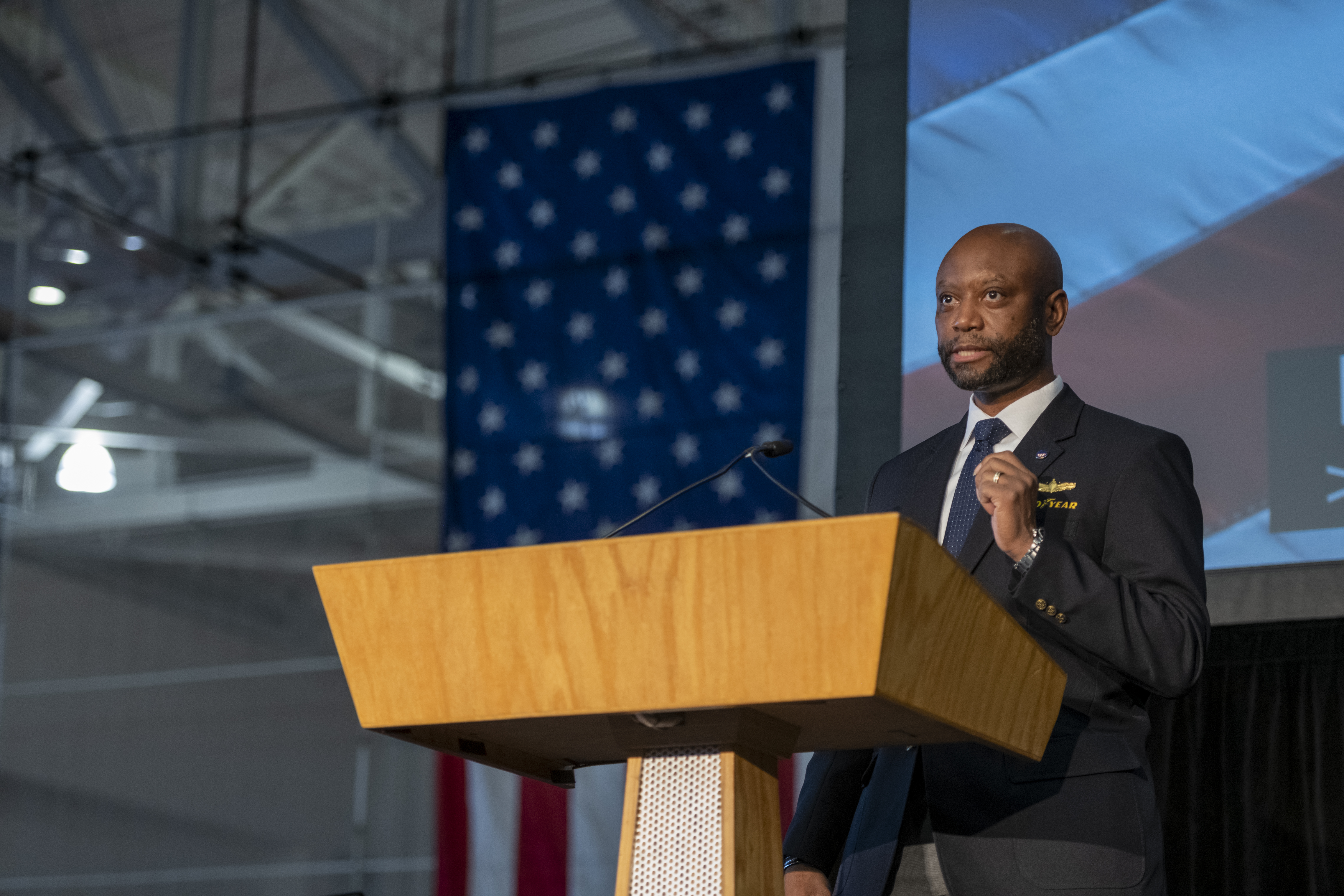 man standing at podeum