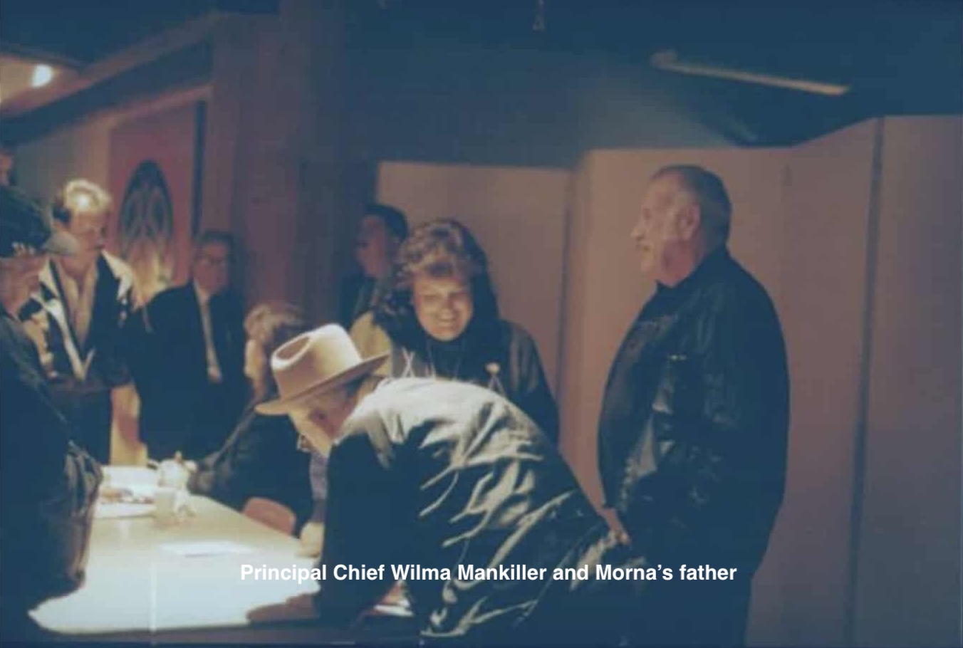 old photo of poeple round a table