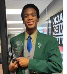​​​​Young man holding an award