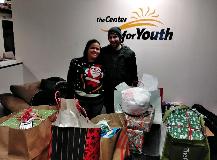 two people in front of gifts