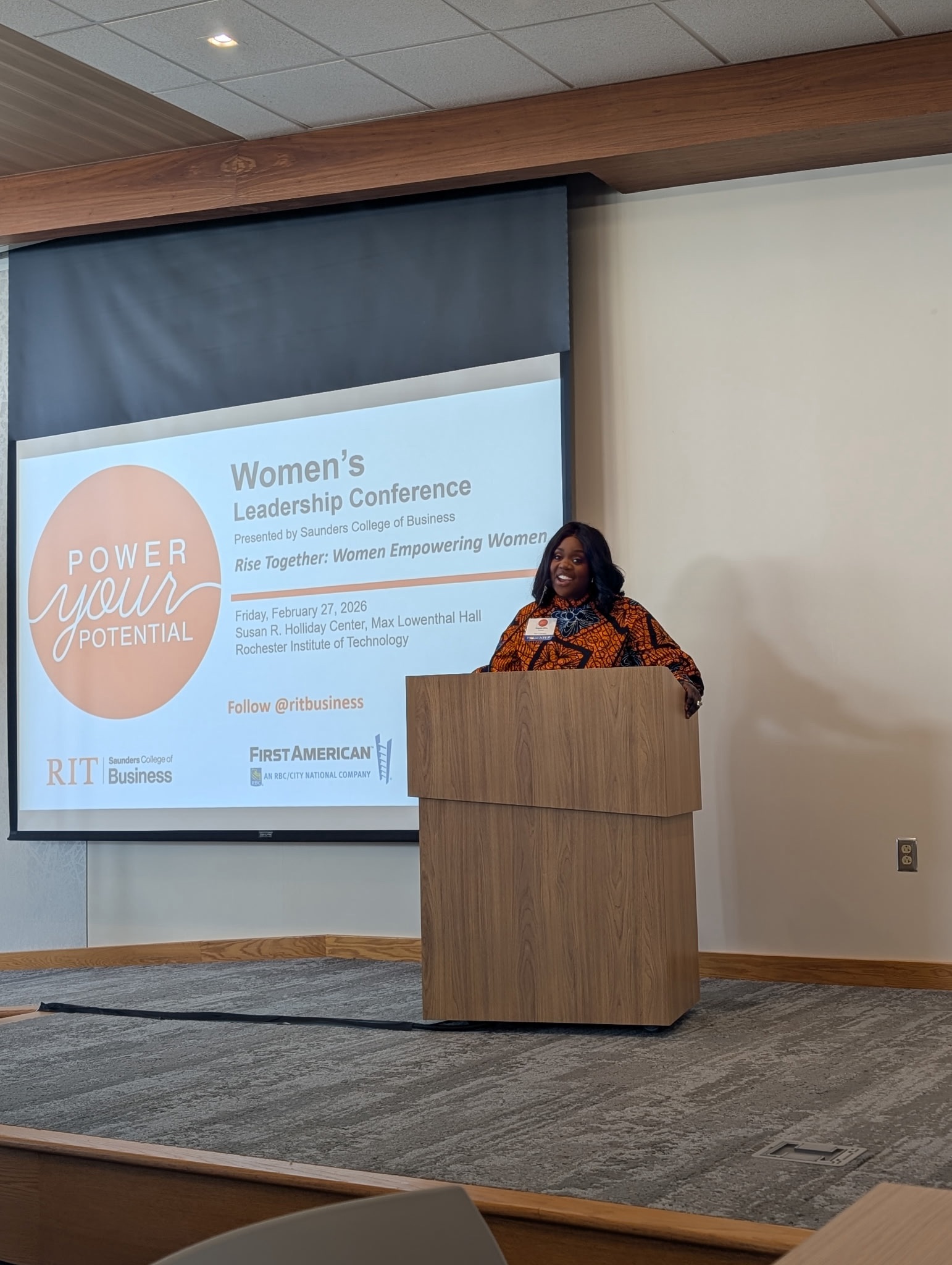 woman talking at a podium
