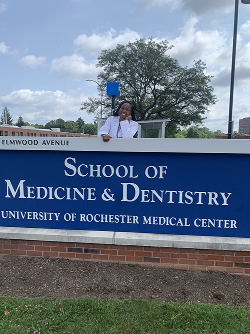 black woman standing outside