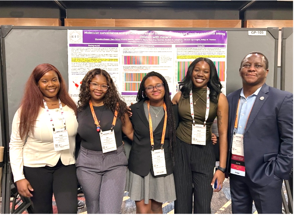 Five people standing in front of of a research board