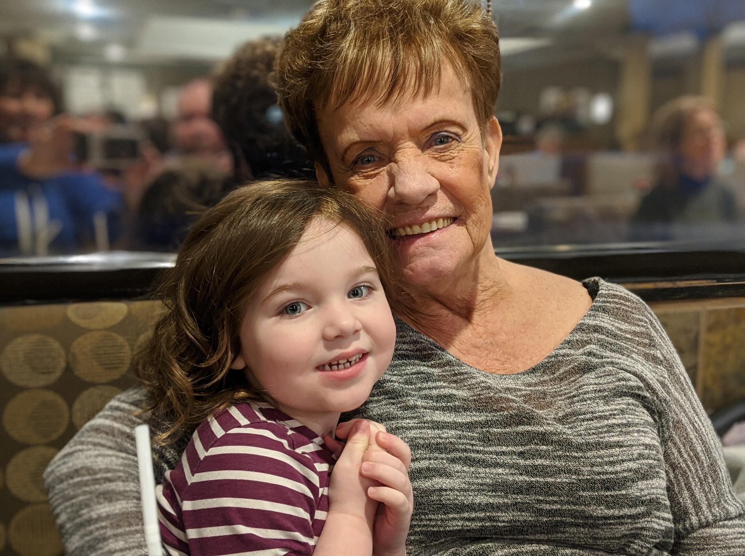 lady sitting with a young girl