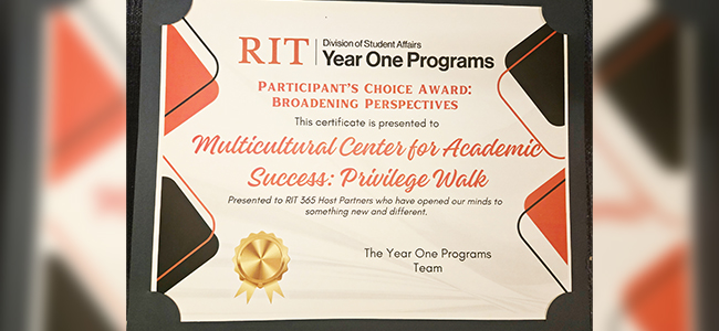 paper award with orange and black text