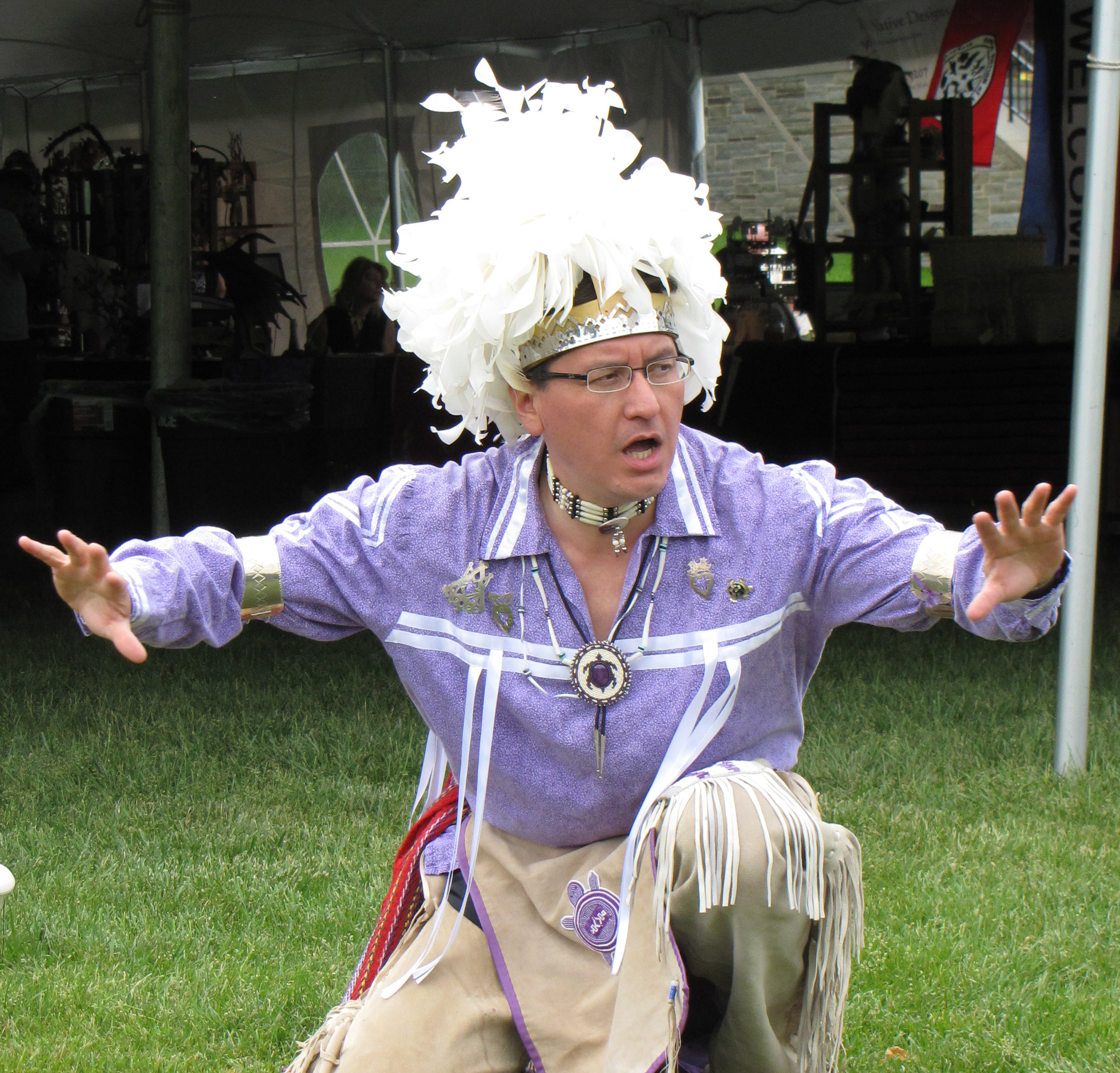 man kneeling on ground 