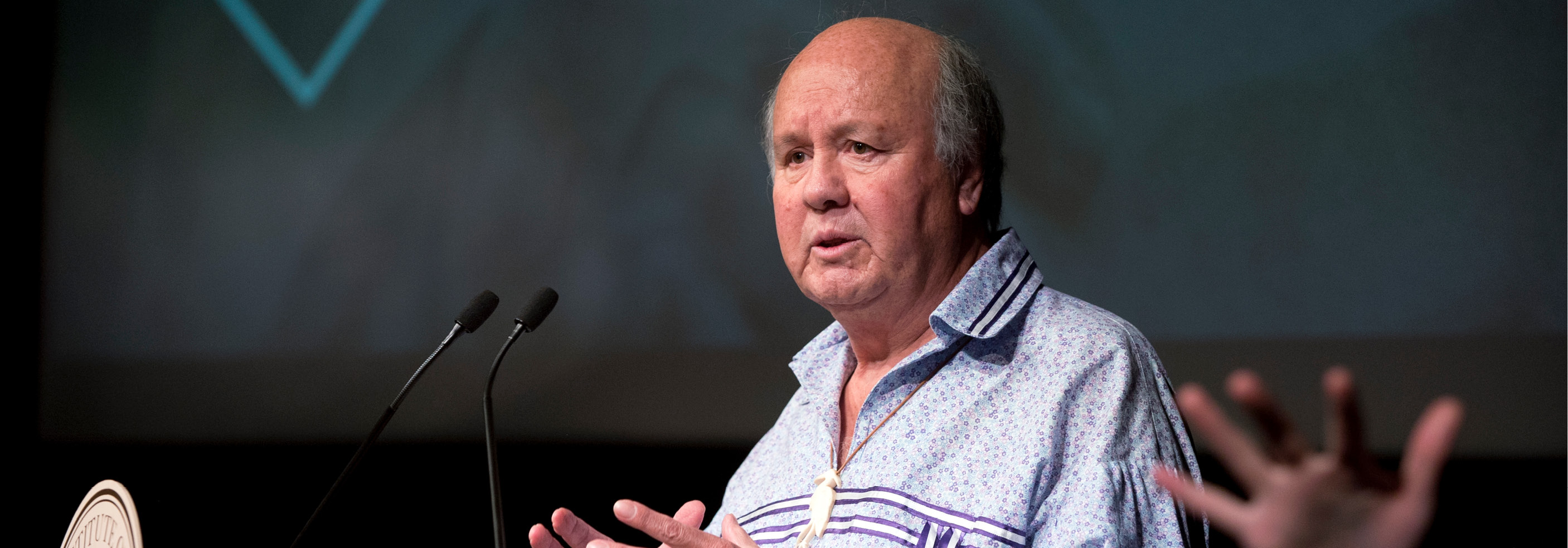 man standing at podium
