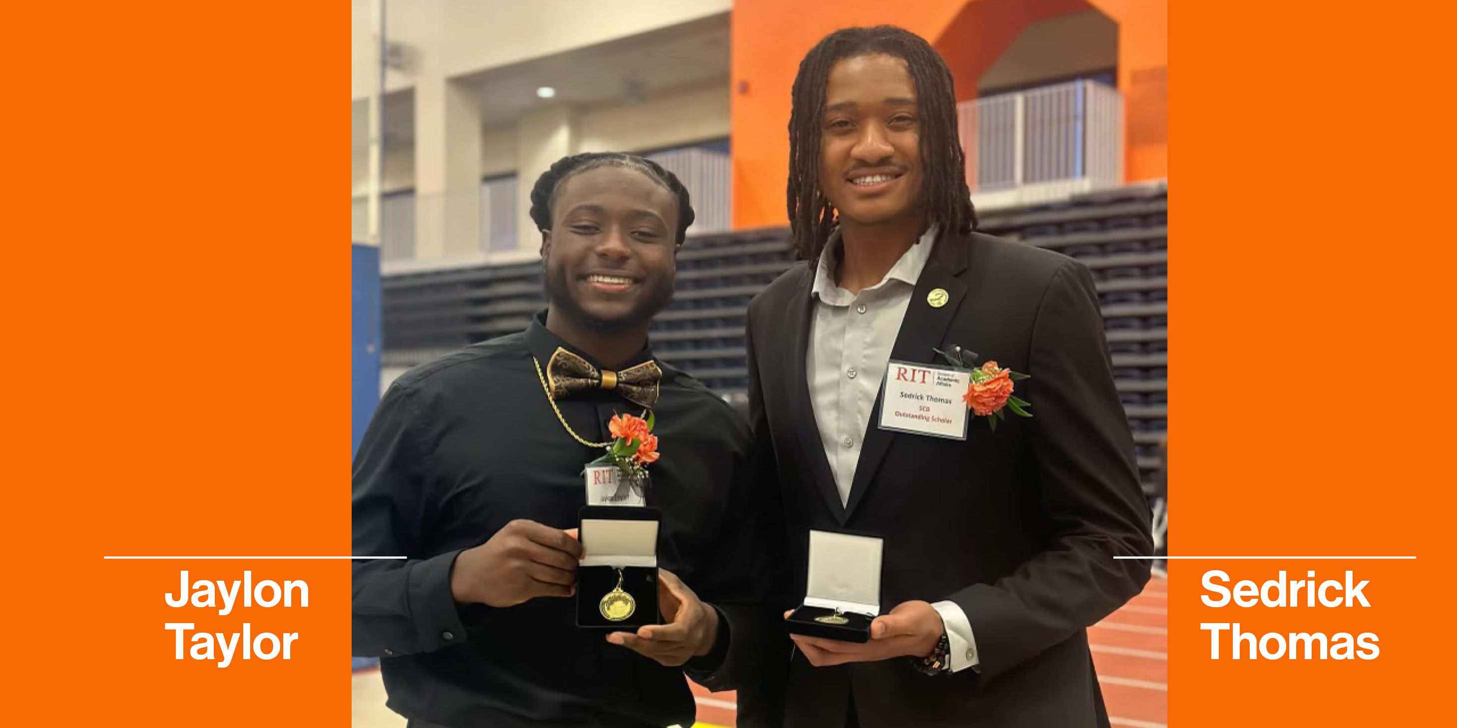Two men standing holding awards