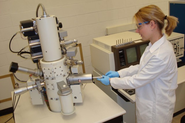 Researcher using machine