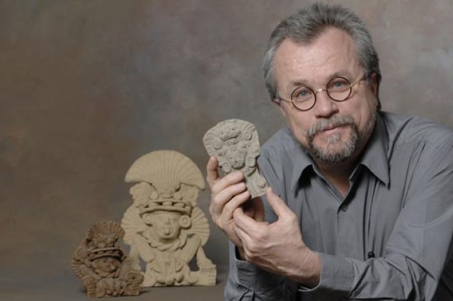 Professor holding artifact