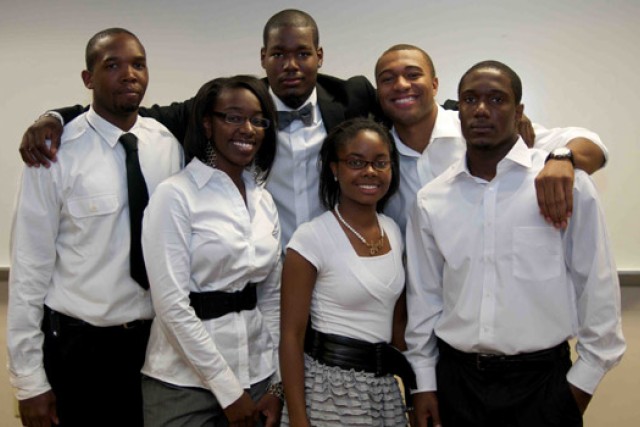 People posing for camera at event