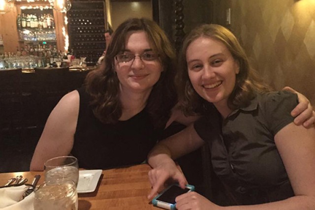 two students out to dinner at a restuarant.
