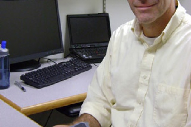Professor posing in office