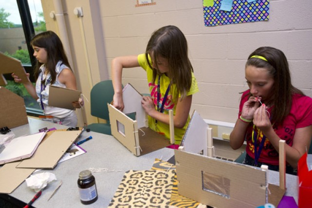 People working on model house