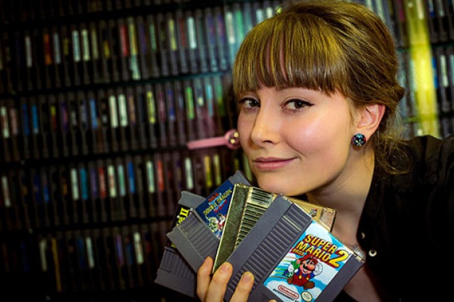 Person posing with games