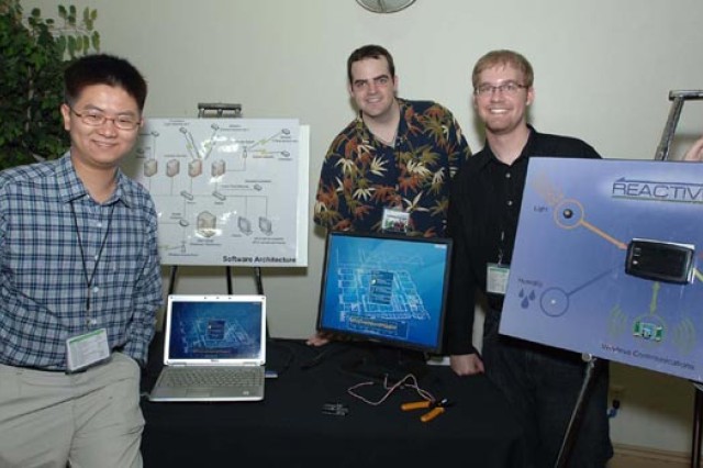 Students standing in front of diagrams