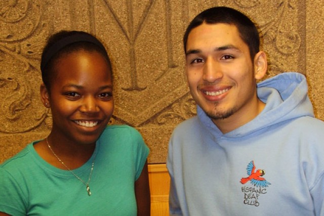 Two people posing for camera