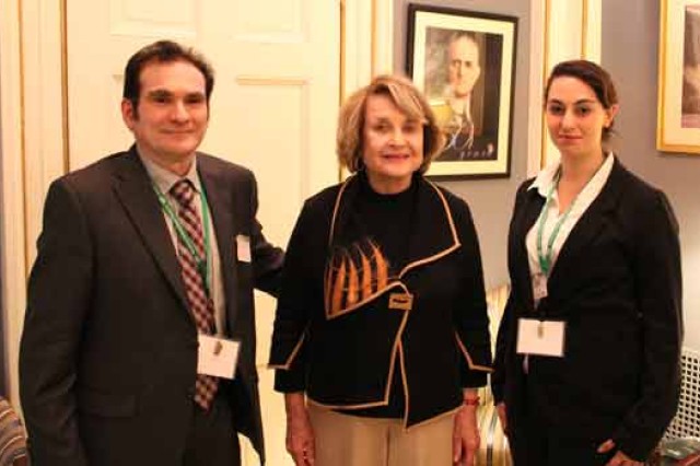 People posing for camera at event