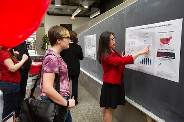 People reading chart on poster