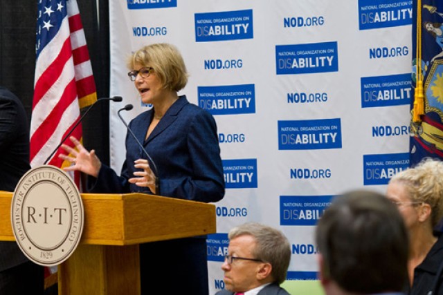 Person giving speech at podium