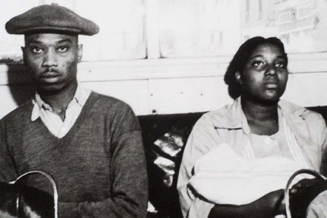 Old photo of two people sitting down