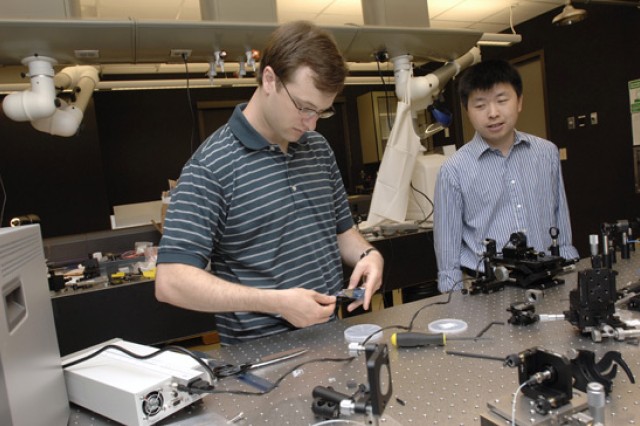 Assistant Professors assembling experiment