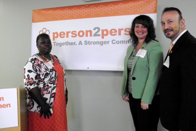 People posing for camera on stage