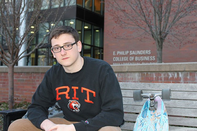 Portrait of Nathan Raw outside of Saunders college of business.