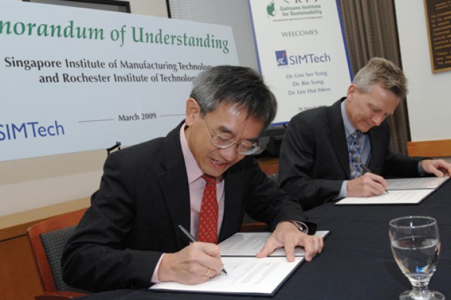 People signing documents