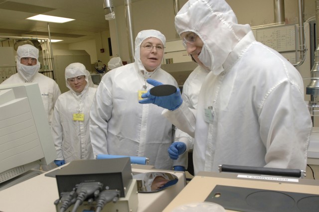 Researcher observing material