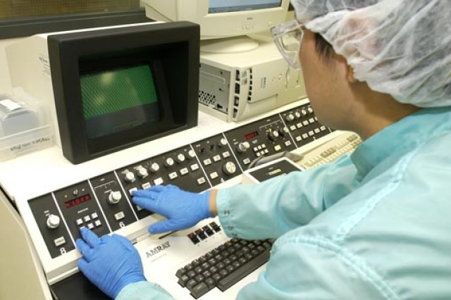Researcher using machine