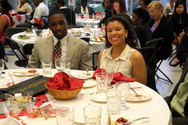 People eating at table at event