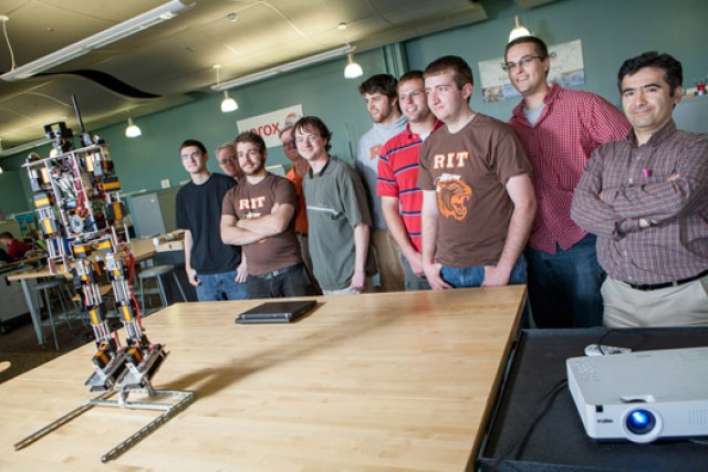 People gathered around robot