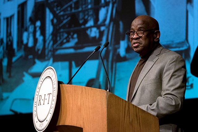 William Davis Jr. standing behind an RIT podium