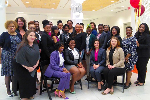 group of multicultural women posing for a photo.