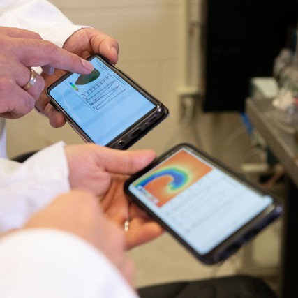 Two smartphone screens side-by-side showing graphs.