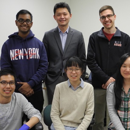Team of five researchers poses.