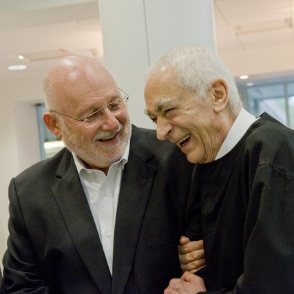 R. Roger Remington and Massimo Vignelli embrace at the dedication of RIT's Vignelli Center for Design Studies.