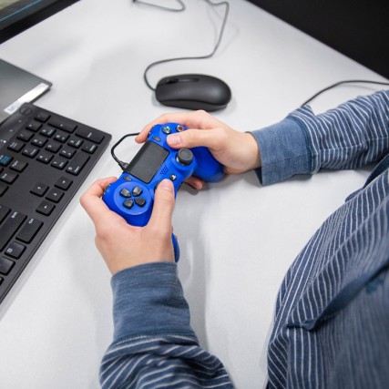 hand holding video game controller.