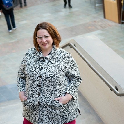 woman posing on stairway.