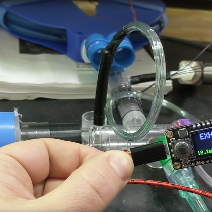 small digital device attached to ventilator.