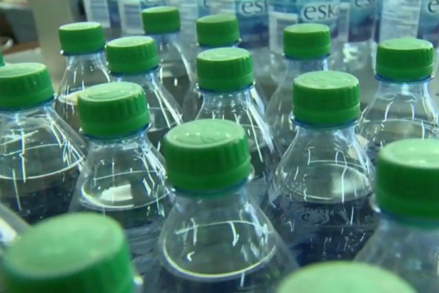 tops of several bottles of water.
