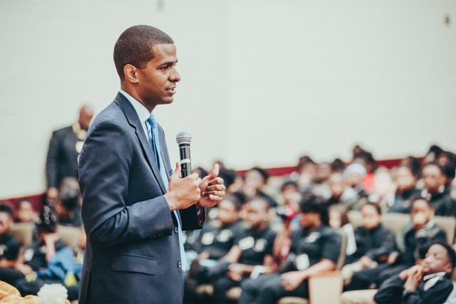 Guest speaker, Bakari Sellers with microphone in front of audience
