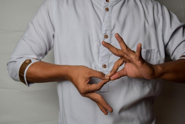 hands using sign language.