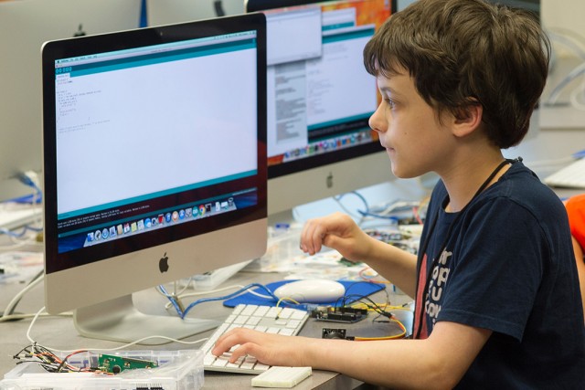 child working on a computer.