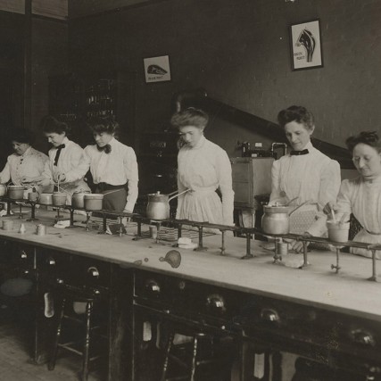 historic photo of women in a cooking lab.