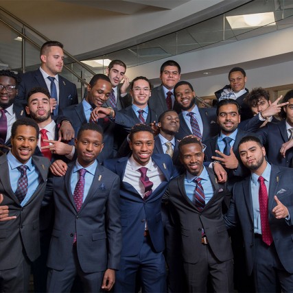 group of students wearing suits.