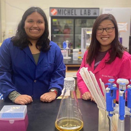 student and professor in a lab.