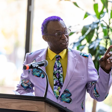 man speaking at podium.